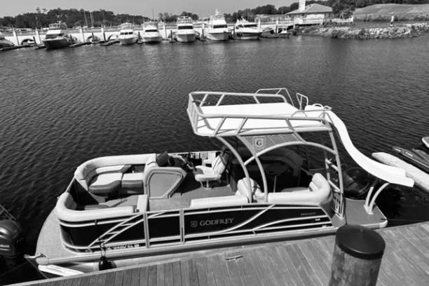 a boat is docked next to a body of water