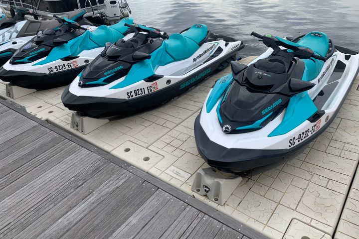 a motorcycle is parked on the side of a boat