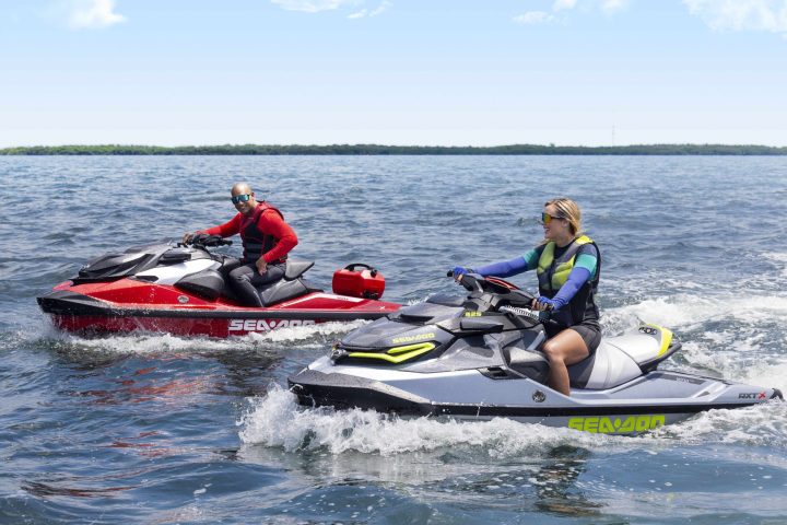 a group of people in a small boat in a body of water