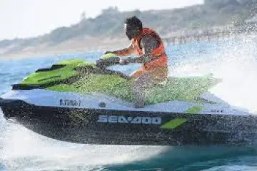 a man riding a wave on a surfboard in the water