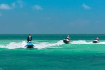 a group of people on a boat in the ocean