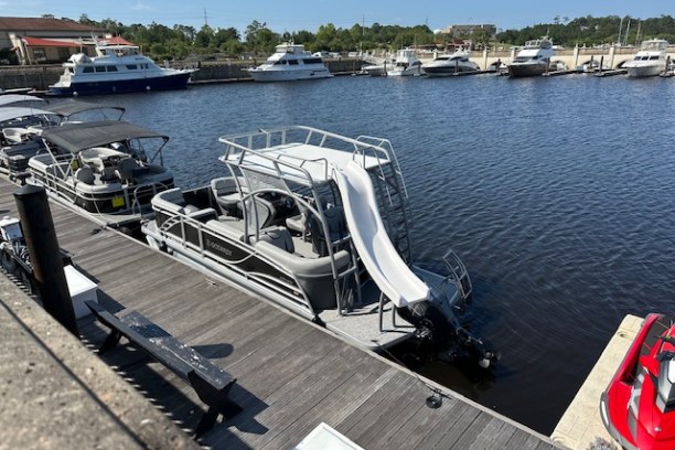 a boat that is sitting on a dock next to a body of water